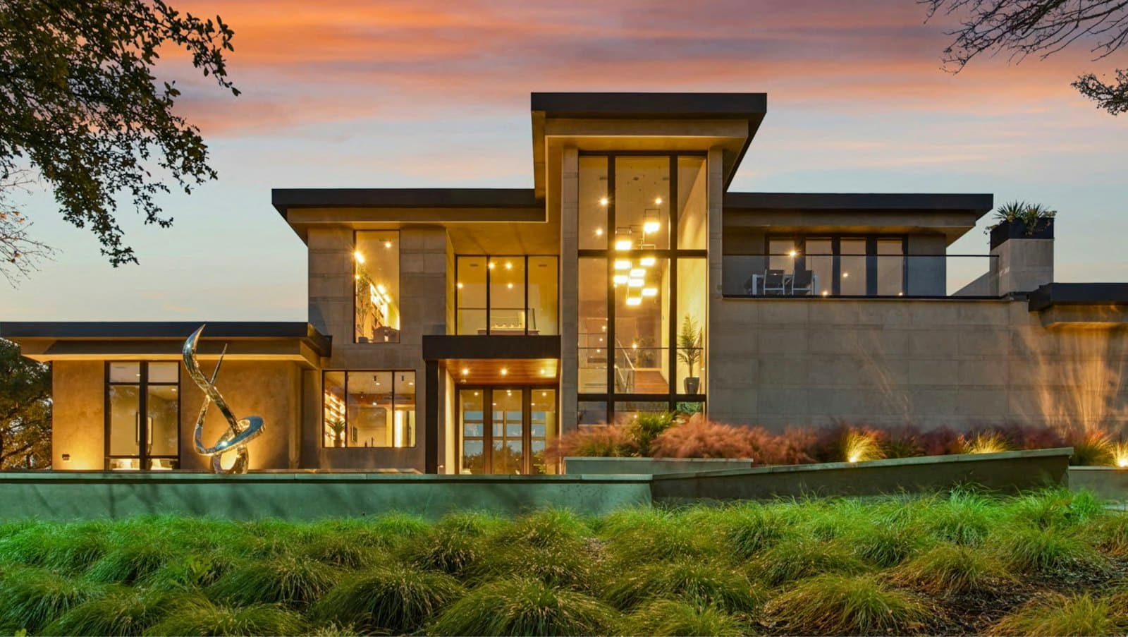 A modern residence with tall windows at dusk